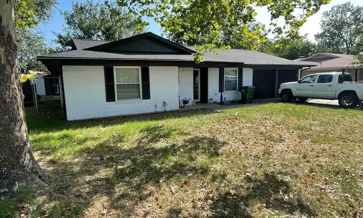 Professional roofing crew working on a residential roof in Lake Holiday